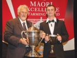 Rakaia Inc chairman James Russell (left) with the Ahuwhenua Trophy and Jack Raharihi, the Young Maori Dairy Farmer of the Year.