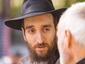 Rabbi Yossel Serebryanski discusses processes with winery staff member Martin Howard.