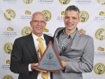 Ben Meyer (left) and his son Miel with the top cheese award.