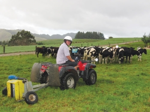 Craig Bowyer measures pasture on an Eketahuna farm.