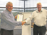 Rural Support Trust chair Neil Bateup (left) receives the cheque from National Fieldays chief executive Peter Nation.