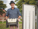 John Vosper loading Jersey Girl organic milk into the truck for delivery. Photo: Life and Leisure