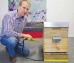 Berywn Hoyt of Brush Technology and Hivemind, with the beehive monitoring hardware at the company’s Christchurch office. 