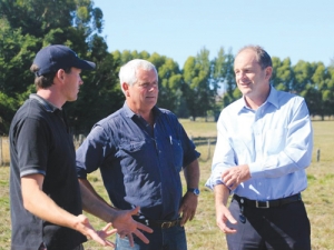 David Shearer (right) talks with farmers.
