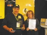 Danny Hall receives his award from Te Radar.