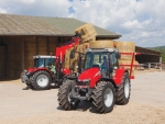 The MF 561 unloading hay bales.