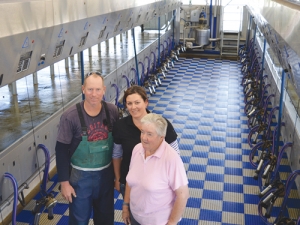 Derek and Catherine Hayward with farm owner Paddy Lockett (right) in the new parallel milking parlour.