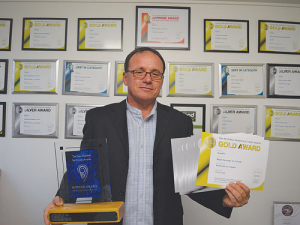 Ginelli’s managing director Max Tairi with his awards.
