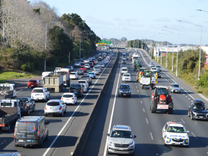 Protestors headed towards the Auckland CBD in one of a series of protests organised by Groundswell NZ.