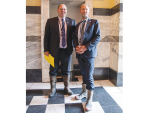 ACT MPs Mark Cameron (right) and Associate Agriculture Minister Andrew Hoggard make their way to the House with gumboots.