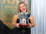 Sarah-Kate Dineen holding the Heritage Rosebowl trophy at the 2023 National Wine Awards Aotearoa New Zealand.