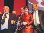 Chairman of Te Kaha 15B Hineora Orchard Norm Carter is presented with the Ahuwhenua Trophy by Governor General Dame Patsy Reddy, with Agriculture Minister Damien O&#039;Connor and Maori Development Minister Willie Jackson also in attendance.