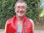 Shearing veteran Peter McCabe with the winner’s ribbon he won at this year’s Golden Shears.