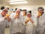 New plant staff enjoy a pizza made with fresh Clandeboye Mozzarella.