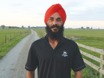 Southland contract milker Janamjot Singh Ghuman is happy to have his job back after being stuck in India for five months.