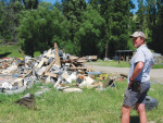 Highfield Station owner Michael Northcote with the remains of his concrete block workshop levelled by the 7.8-magnitude quake.