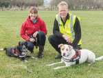 Fiona Thomson with Tahi and Geoff Bowers with Nala during a Chilean needle grass detection training session near Christchurch. 