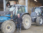 Chris Kenel with his Valtra tractors. Kenel says the only thing that has worn out is the seat (right).