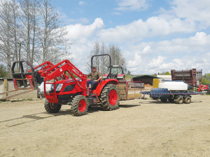 Jason Turner with his new Kioti NX 6020 tractor.