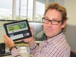 Ramon Oosterkamp with tablet displaying MetService’s weather app.