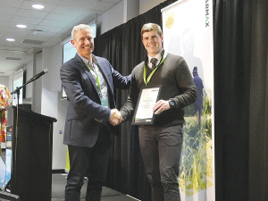 Farmax chief executive Gavin McEwan (left) with Emerging Rural Professional of the Year Blake Gunn.