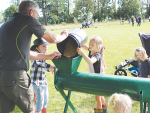 Kiwitahi School students help transferring grains through an auger.