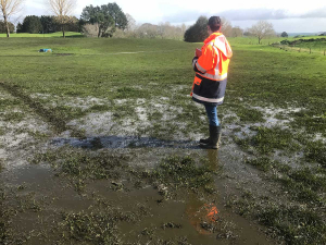 Waikato Regional Council officer inspecting extent of over application of effluent.