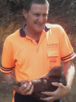 Peter Eagles holding a kiwi from the pilot programme.