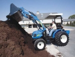 The New Holland Boomer comes with accessories like frontloaders.