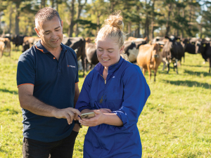 Nedap General Manager Oceania, Greg Hamill on farm in Taranaki with farmer Elly Grahame.