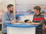 Niall Walsh talks with a potential student at National Ploughing Champs.