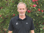 Freshco director John Mangan in one of the company’s apple orchards. Photo: Freshco.