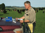 A farmer using FECPAK animal health test kits.