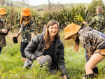 4. Taiea te Taiao ecological corridor project coordinator Bexie Towle and schoolchildren plant for future generations as part of the project.