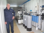 Terry Hawes and the prototype effluent treatment system.