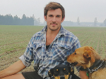 Cust farmer Roscoe Taggart checks his newly planted wheat crop with his dogs Pip, Sass and Rose. 