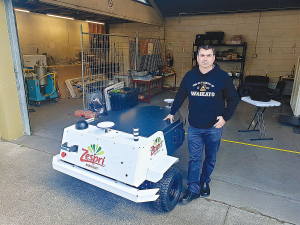 Nick Pickering with the Orchard Survey Robot funded by Zespri.