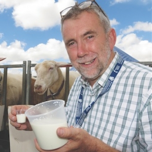 Massey University Craig Prichard with sheep milk.