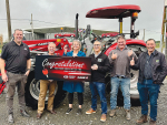 Lil Poulton with the family’s new Case IH tractor. Others in the picture, from left are Robby Smith, Murray Grant, Terry Copeland, John Kilmister and Jim Galloway.