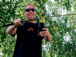 Rudi Brauer uses the traditional French Sabrage technique to open a bottle of Sparkling wine.