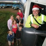 Fonterra Shareholders, the Woolerton family, get ready for Christmas with Fonterra tanker driver Shane Vercoe  