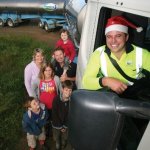 Fonterra Shareholders, the Woolerton family, get ready for Christmas with Fonterra tanker driver Shane Vercoe 