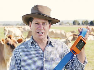 Ian Reilly, chief executive of Agersens, with a prototype of the company’s GPS and wireless-connected collars.  