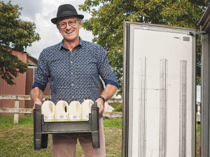 John Vosper loading Jersey Girl organic milk into the truck for delivery. Photo: Life and Leisure