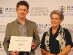 William Gearish Memorial Award winner Toby Collis receives the award from Professor Nicola Shadbolt.