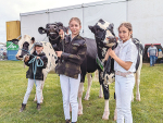 The McIntosh sisters Peggy, 8, left, Maggie, 12, and Olive, 10, with three of the family’s Holstein Friesian heifers which they paraded for the judges on the first day of the 2023 NZ Agricultural Show.