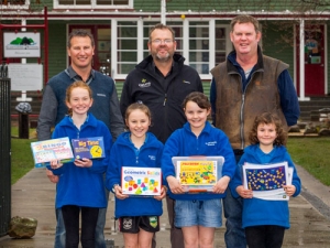 Chris Bascand (back-left), Hatuma&#039;s Nigel Wilson and farmer Hamish Thorne with students holding some of the new resources.