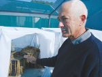 Landcare research technician Lindsay Smith with pots of Field Horsetail in which he is breeding weevils for a biocontrol project. The plants naturally die down in winter but these are hosting weevil larvae in the roots and are not expected to recover in Spring. Rural News Group