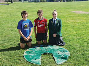 Hamish Ryall, Luke Jordan and Amy Hay with a prototype of their Flexi Mat FrostEase device, which is designed to stop water troughs from icing over during the winter.