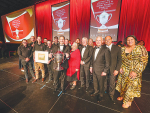 Wi Pere Trustee Kingi Smiler (with trophy) and other members of the Trust and Government Ministers at the awards ceremony. Credit: Alphapix Photography.